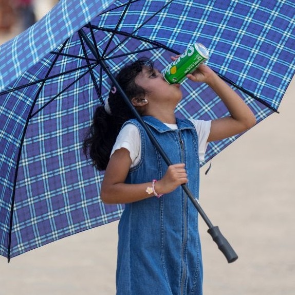 India splits into two weather worlds on May 23: searing heatwaves above 45 degrees Celsius in the north, and heavy thunderstorms in the south and northeast. (Photo: PTI)