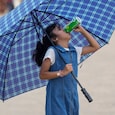 India splits into two weather worlds on May 23: searing heatwaves above 45 degrees Celsius in the north, and heavy thunderstorms in the south and northeast. (Photo: PTI) India splits into two weather worlds on May 23: searing heatwaves above 45 degrees Celsius in the north, and heavy thunderstorms in the south and northeast. (Photo: PTI)