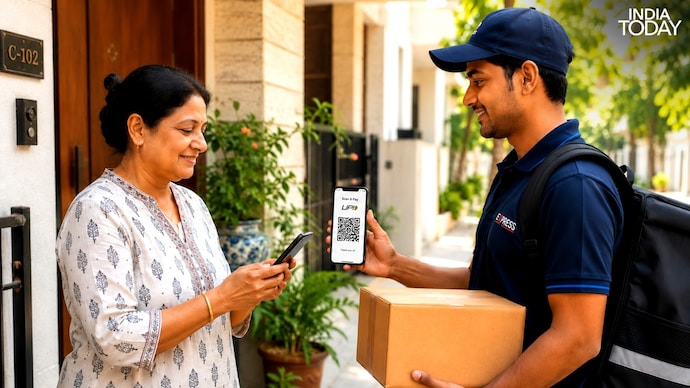 A woman paying a delivery boy via UPI. (Image: AI Generative) indian woman paying via UPI