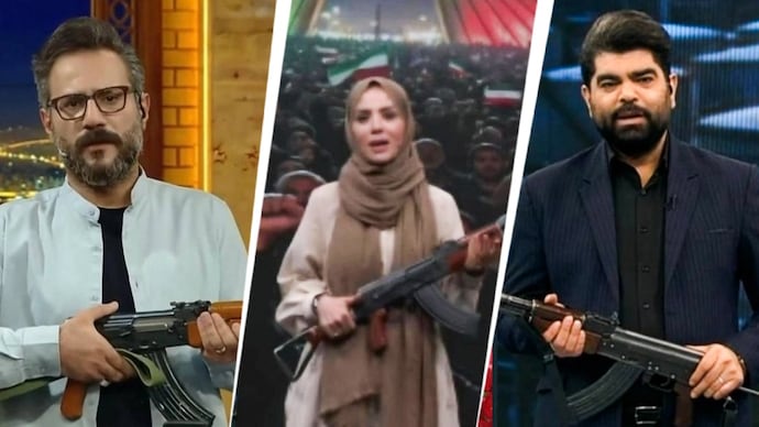Iranian state TV anchors holding rifles. Iranian state TV anchors holding rifles.