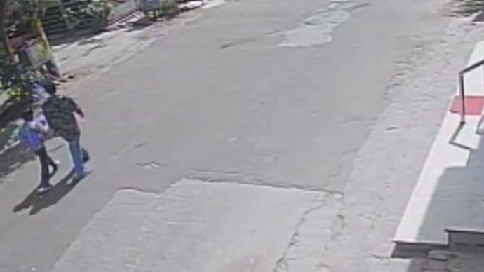 The accused on the right is seen with the victim in this CCTV footage acquired by the police near the crime scene. (Screengrab) Kota child rape and murder