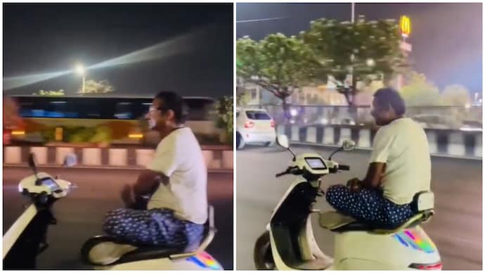 Lucknow man rides scooter with folded arms and legs Lucknow man rides scooter with folded arms and legs