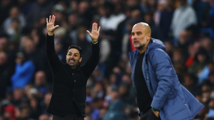 Five points separate Arsenal and Manchester City as Premier League title race heats up. (Photo: Reuters) Mikel Arteta, Pep Guardiola, Premier League