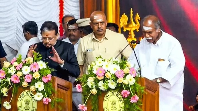 AINRC founder N Rangasamy (right) takes oath as the Puducherry Chief Minister for the fifth time on Wednesday.