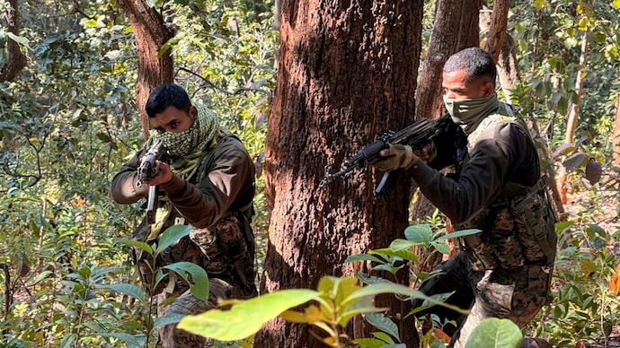 Armed security personnel during a gun battle with Naxalites at Saranda forest Naxal free India