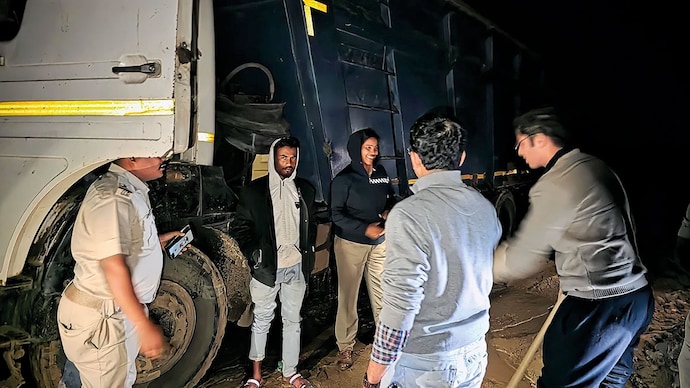 NIGHT OPERATION: Police with a seized truck used in illegal mining in Balasore, Odisha, May 14 (Photo: Arabinda Mahapatra)