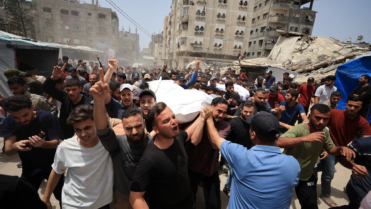 Mourners carry the bodies of Palestinians who were killed in an Israeli strike, according to medics, in Gaza City (Photo- Reuters)