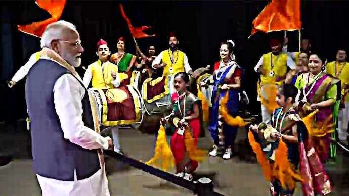 PM Modi watching cultural performance by the members of the Indian community in The Hague. PM Modi in the Netherlands