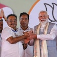 PM Modi with BJP MP and West Bengal BJP president Samik Bhattacharya during a public meeting ahead of the West Bengal Assembly elections. (PTI) PM Modi with BJP MP and West Bengal BJP president Samik Bhattacharya during a public meeting ahead of the West Bengal Assembly elections. (PTI)