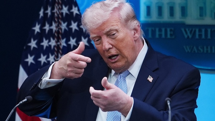 AP) President Donald Trump pretends to aim a sniper gun while speaking with reporters in the James Brady Press Briefing Room at the White House, Monday, April 6, 2026, in Washington. (AP Photo/Julia Demaree Nikhinson)