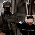 Since the Israel-Hamas war began, released Palestinian detainees have alleged torture, violence and sexual abuse inside Israeli prisons. (Image for representation: Getty) Since the Israel-Hamas war began, released Palestinian detainees have alleged torture, violence and sexual abuse inside Israeli prisons. (Image for representation: Getty)