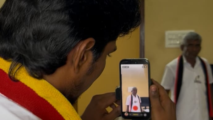 The father-son duo is from Erode — a region where the TVK performed strongly in the elections, winning five of the district’s eight Assembly constituencies Tamil Nadu TVK DMK