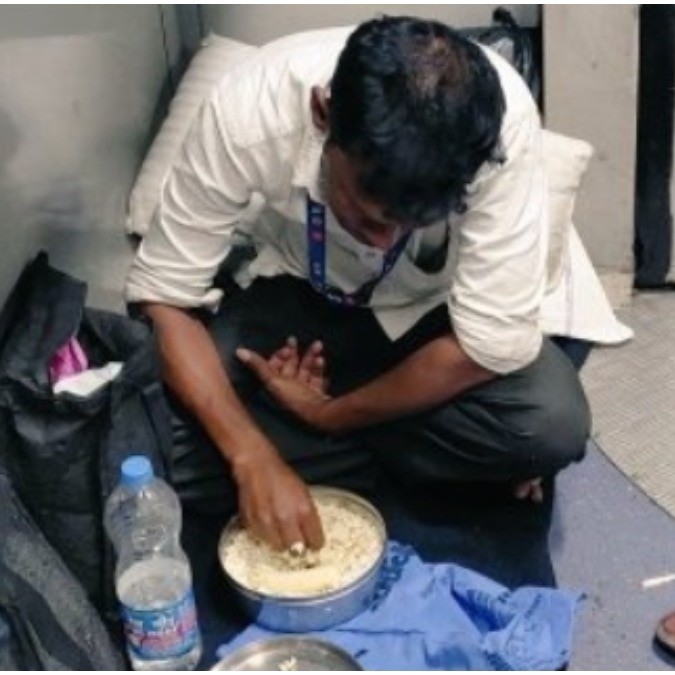 Viral photo of train attendant eating on floor sparks appeal for basic seating
