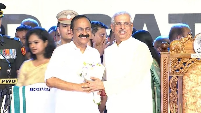 VD Satheesan with Governor Rajendra Arlekar at oath ceremony. VD Satheesan taking oath as Kerala Chief Minister.
