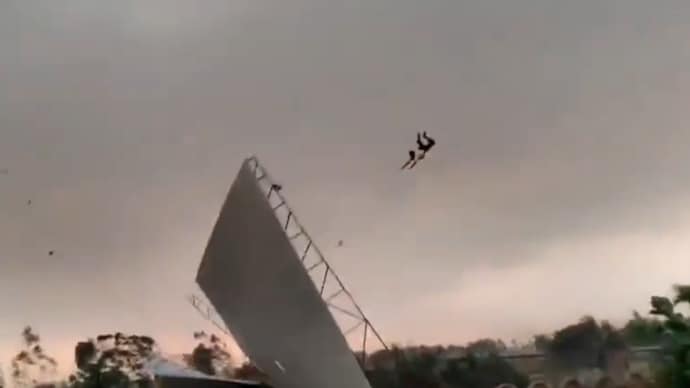 A man was tossed in the air as gusty winds blew away temporary roofs in Uttar Pradesh during deadly storms. (Photo: Screengrab) Watch: Stormy winds send a man and a roof flying in Uttar Pradesh