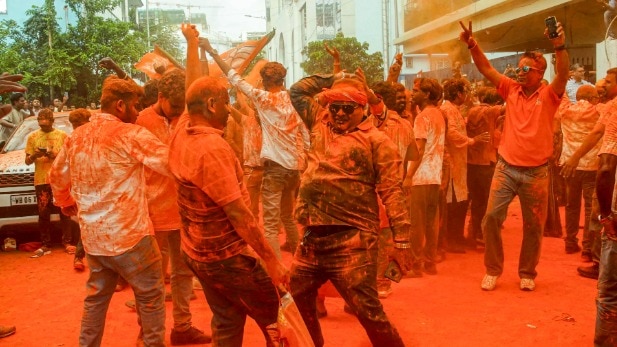 BJP supporters celebrate in Kolkata as the party surged to a landslide victory in the West Bengal Assembly polls. (Photo: PTI)