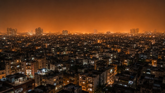 An aerial view of a dense concrete city, illustrating heat island effect and heat. (Representational Photo: AI) Why your homes feel hot after the Sun goes down