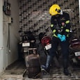 A firefighter inspecting the cylinder damaged in the blast. A firefighter inspecting the cylinder damaged in the blast.