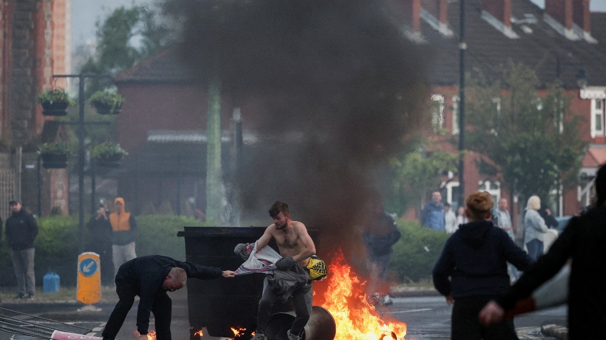 Bus torched, streets erupt as Belfast stabbing fuels migrant backlash