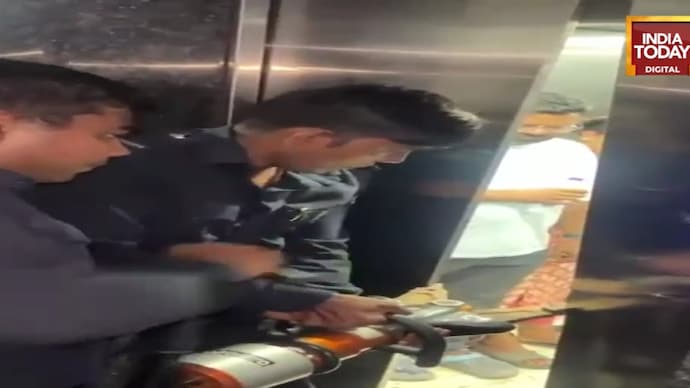 Visuals of Surat Fire Brigade personnel rescuing people trapped inside a lift at the Gallopin Complex in the Vesu area of Surat. Child among six rescued after being trapped in Surat lift for 45 minutes