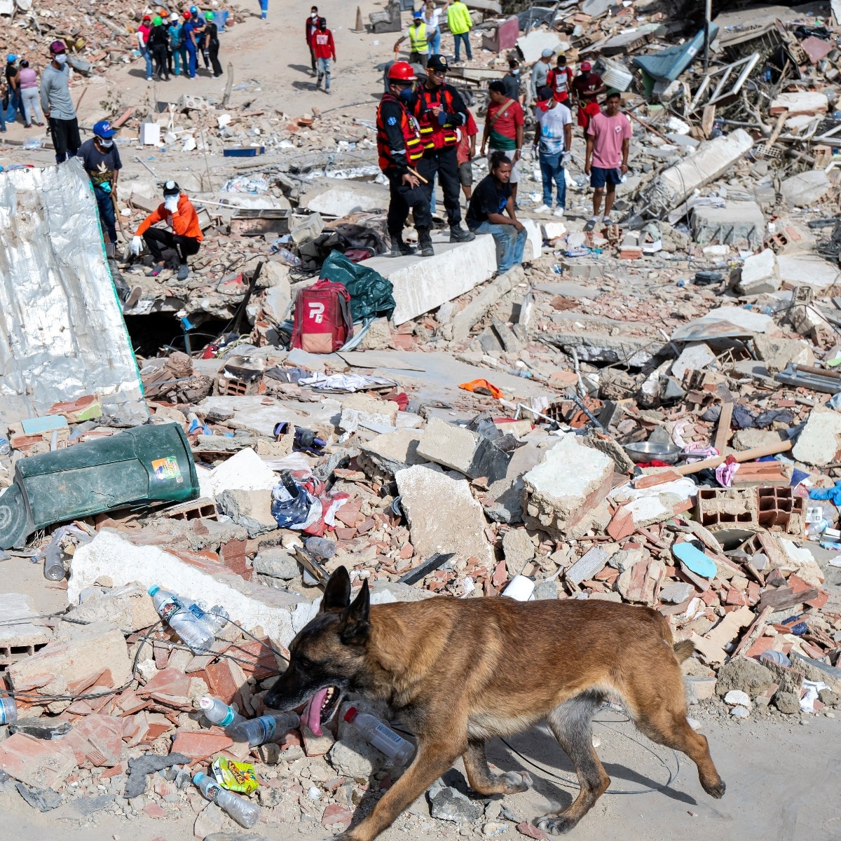 Rescuers pull father and son alive from Venezuela quake rubble after four days