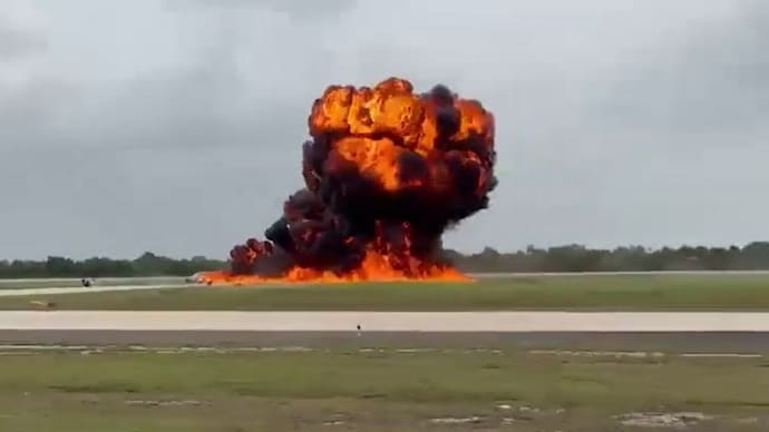 Flames engulf private jet after deadly emergency landing crash. Flames engulf private jet after deadly emergency landing crash.