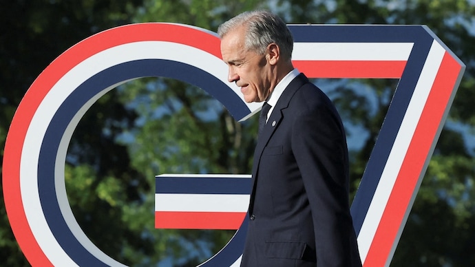 Canadian Prime Minister Mark Carney walks during the G7 summit in Evian-les-Bains, France. (Photo: Reuters)
