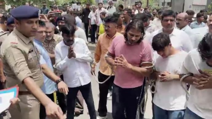 The attack was part of a pre-planned conspiracy to avoid returning money that had allegedly been taken from the complainant under false promises. Gandhinagar Police action