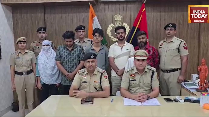 Gurugram Police personnel with the five accused arrested in a crackdown on a credit card limit enhancement scam. Gurugram Police bust Delhi-based fraud network targeting credit card users