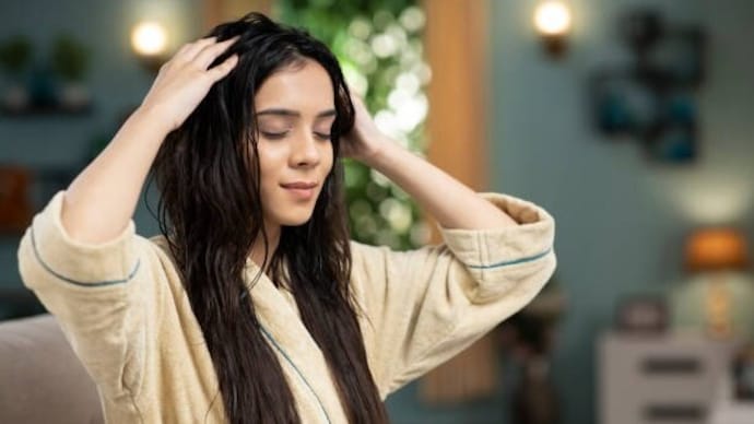 Hair spa starts by applying warm oil to the hair.