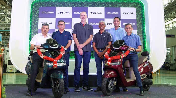 KN Radhakrishnan, Director and CEO, TVS Motor Company and the leadership team with the the TVS iQube.