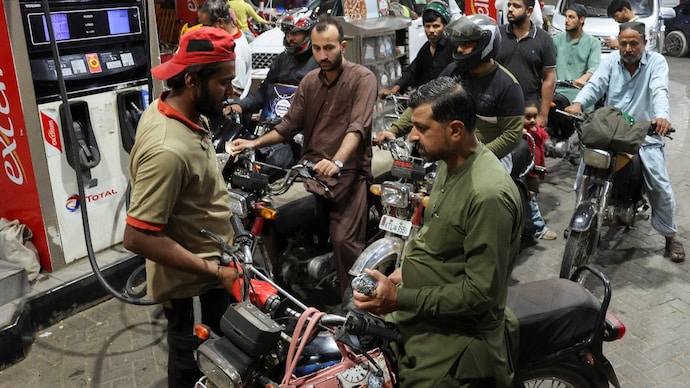 People wait for their turn to get fuel at a petrol station, amid the Middle East crisis. (File Photo: Reuters) People wait for their turn to get fuel at a petrol station, amid the Middle East crisis. (File Photo: Reuters)
