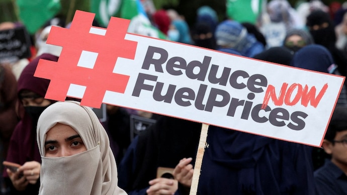 A woman holds a placard during a protest against fuel price hikes in Islamabad. (Reuters)