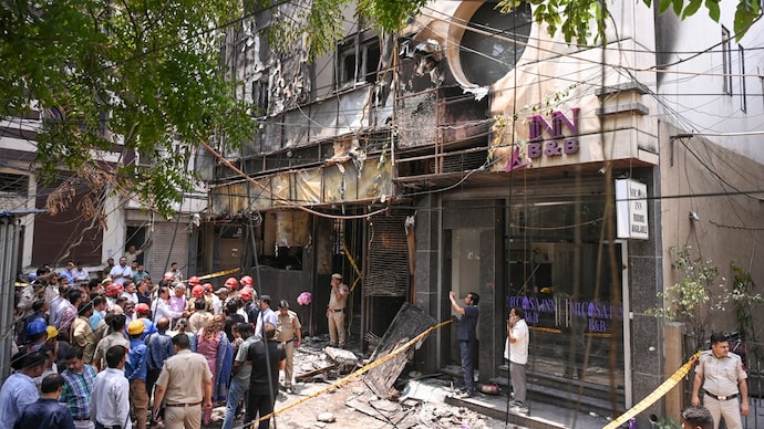 Police and firefighters at the site after a fire broke out at a bed-and-breakfast in a five-storey building in south Delhi's Malviya Nagar area. (Photo: PTI) Police and firefighters at the site after a fire broke out at a bed-and-breakfast in a five-storey building in south Delhi's Malviya Nagar area
