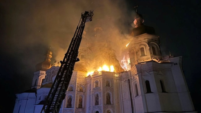 Firefighters work at a site of the Dormition Cathedral of the Kyiv Pechersk Lavra monastery, which burns after it was hit during Russian missile and drone strikes. (Photo: Reuters)