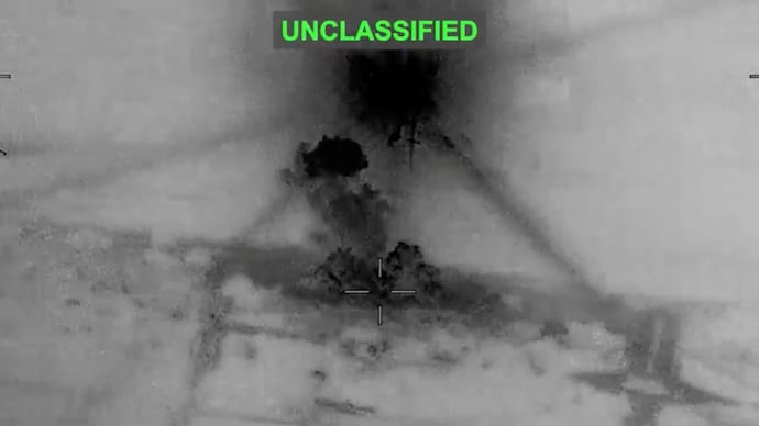 Smoke rises from explosions at an unknown location, following what U.S. Central Command (CENTCOM) said were strikes on Iran in response to an Iranian drone strike on a cargo ship in the Strait of Hormuz