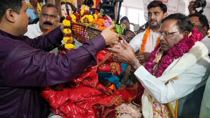 Uttar Pradesh BJP President Pankaj Chaudhary offers prayers on the occassion of the completion of 12 years of the NDA government, in Lucknow. (PTI)