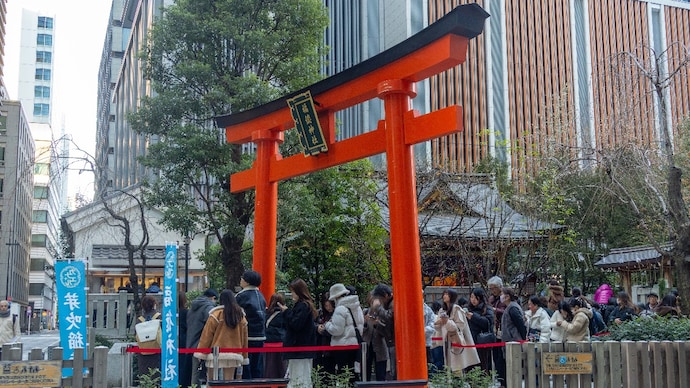 This Japanese shrine is nestled between high rise buildings