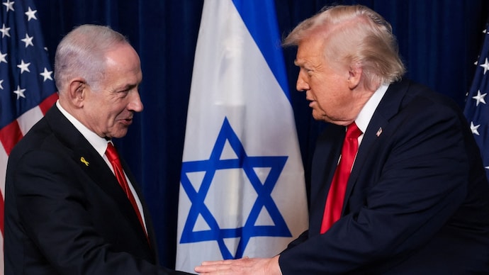 US President Donald Trump and Israeli Prime Minister Benjamin Netanyahu hold hands during a press conference. (File Photo: Reuters)