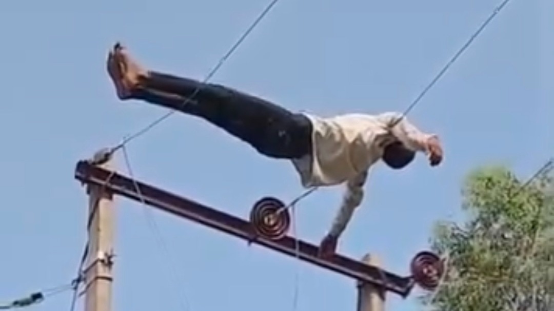 Drunk man climbs 11,000-volt electricity pole, lies on wires in UP village