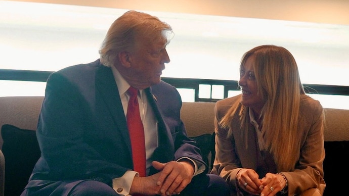 U.S. President Donald Trump speaks to Italian Prime Minister Giorgia Meloni on the sidelines of the G7 Summit