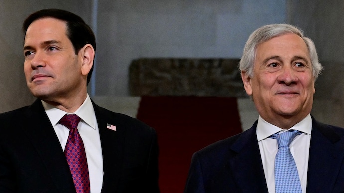 US Secretary of State Marco Rubio (L) is welcomed by Italy's Deputy Prime Minister and Foreign Minister, Antonio Tajani