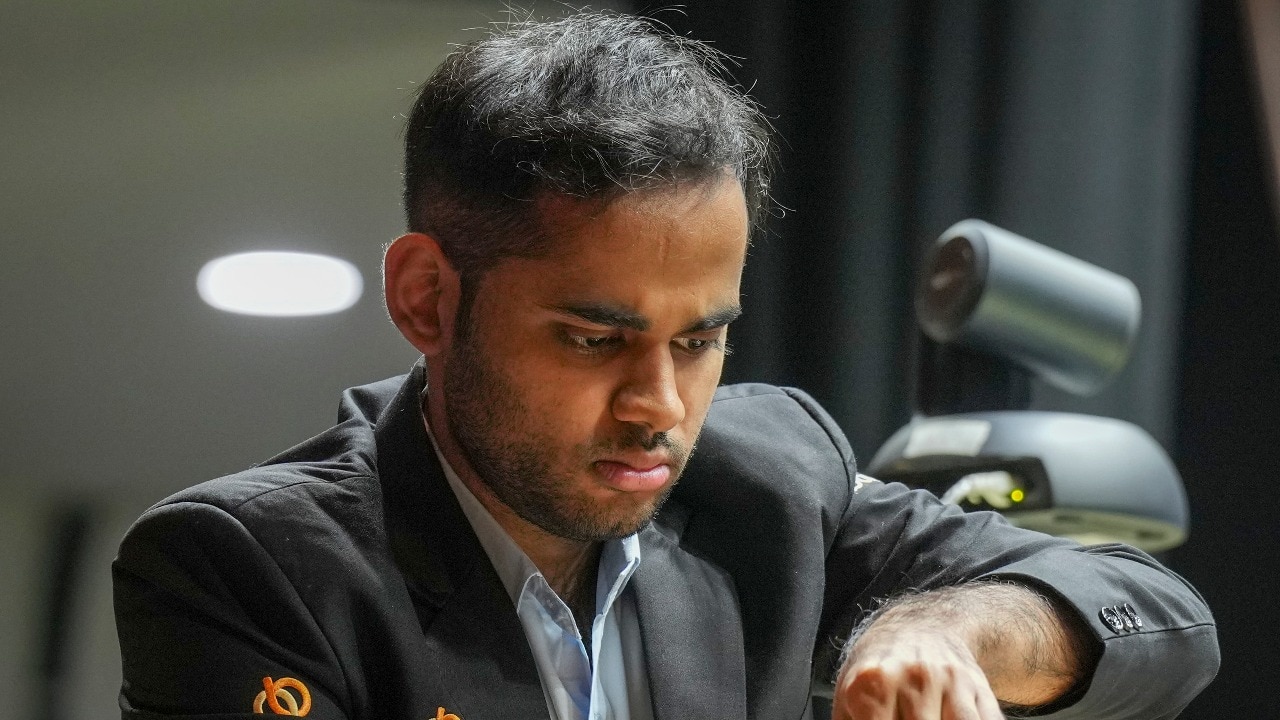 Arjun Erigaisi defeats world champion Gukesh with Black to move into joint lead