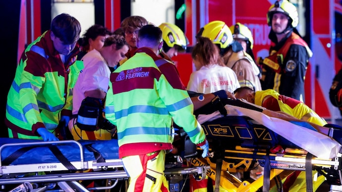 Emergency responders work on the site, after the annual Berlin's Christopher Street Day Pride parade was called off, after a car crashed into the crowd at Tiergarten park, leaving several people injured, in Berlin, Germany. (Photo- Reuters)