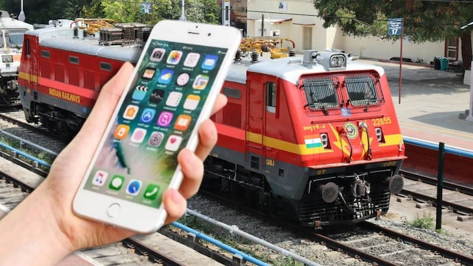 Booking train tickets on mobile.-File photo