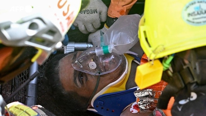 Camera captures Hernan Gil Flores trapped beneath earthquake rubble.