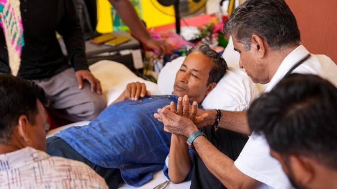 Climate activist Sonam Wangchuk being attended by medical professionals during a protest by Cockroach Janata Party
