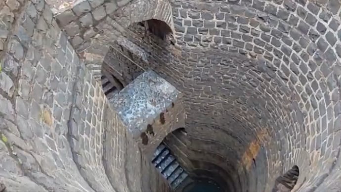 A near 300-year-old stepwell in Belagavi has been restored by volunteers after decades under waste and silt(Image source: PTI)