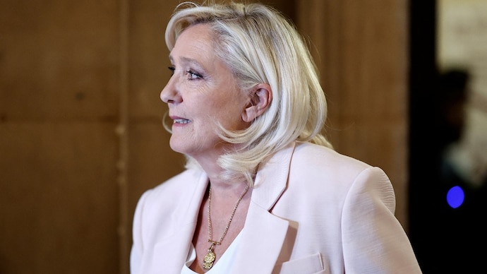 French far-right leader Marine Le Pen arrives to attend the verdict in her appeal trial