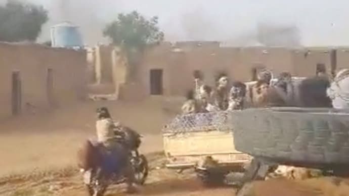 Militants ride in vehicles after chant "God is Great" in Anefis, Mali, as gunshots ring out. (Reuters)